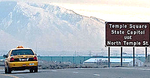 A cab is driving out in a rural part of Utah