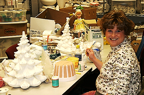 Ceramic class participant working on a project