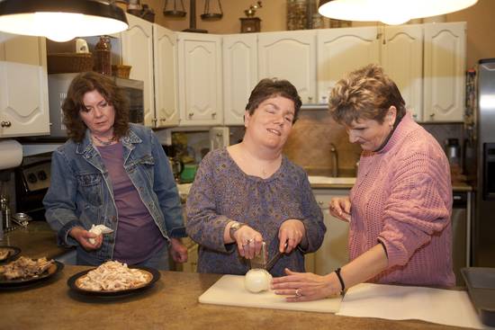 Tonya Neff-Roberts and Carol Grundmann work with Missy VanCampen as Team Teacher Trainers